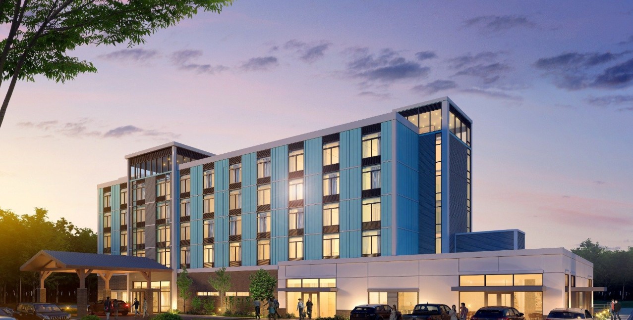 Exterior view of a modern hotel property at dusk